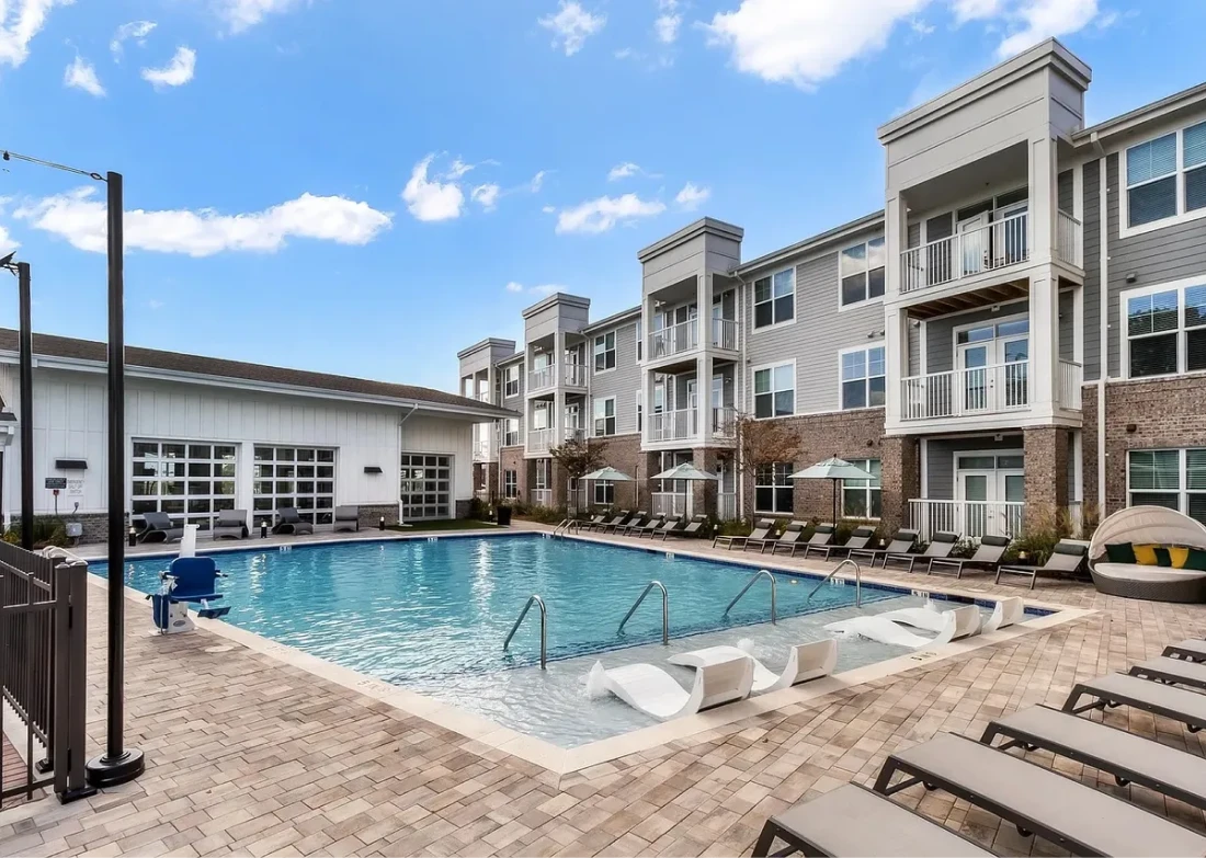 Modern apartment complex with swimming pool
